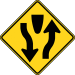 A Divided Highway symbol sign should be used on the approaches to a section of highway (not an intersection or junction) where the opposing flows of traffic are separated by a median or other physical barrier. The word message DIVIDED HIGHWAY or DIVIDED ROAD sign may be used as an alternate to the symbol sign.