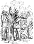 A man preaching to a crowd in medieval times in front of a large cross.