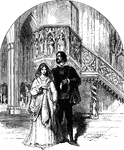 A young couple standing in near the ornate pulpit of a gothic church.