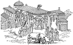 Illustration of an Anglo-Saxon manor house or noble's house from 11th century England. There are several porticoes and entrances to the house. People huddle in the entryways, some have shields and spears. An animal head with antlers is at the pinnacle of one roof. The lord and lady are giving alms to several poor people in the courtyard. There is a line of men with canes, a group filling large pottery jars, and a line of people reaching for alms.
