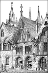 Illustration of the storefront of a medieval shop on a street with buildings on either side. Spires rise in the background. Much of the architecture is in the Gothic style. Two men stand in the street. Two women stand just outside the shop. What appears to be a statue of an angel with a sword adorns the outside wall of the shop.