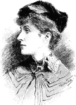 An adult woman with short hair wearing a hat.