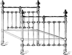 A decorative bed frame made out of iron, with brass knobs at the top.
