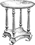 A colonial design parlor table made out of oak.