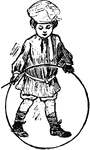 A boy playing with his hoop and stick.