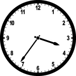 Round clock with numbers showing time 3:36