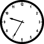 Round clock with numbers showing time 9:35