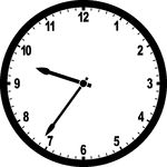 Round clock with numbers showing time 9:36
