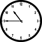 Round clock with numbers showing time 10:45