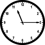 Round clock with numbers showing time 11:15