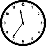 Round clock with numbers showing time 11:36