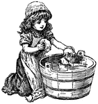 Girl giving her doll a bath.