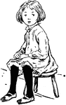 A girl sitting on a little stool.