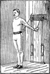 A man exercising with chest weights. In this position, he is pushing his arms down, right and left together repeatedly.