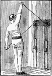 A man exercising with chest weights. In this position, he is pulling down with his left arm and up with his right, alternately repeating.