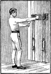 A man exercising with chest weights. In this position, he extends the right arm out fully and brings the left arm to the right, across his chest.