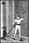 A man exercising with the paddling machine, low attachment.