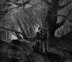 A young couple walking arm in arm in the woods.