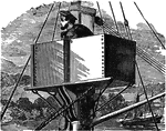 A man standing in an armored lookout.