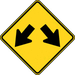 The Double Arrow sign may be used to advise road users that traffic is permitted to pass on either side of an island, obstruction, or gore in the roadway. Traffic separated by this sign may either rejoin or change directions.