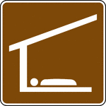 This sign is used to indicate that a sleeping shelter is located nearby.