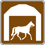 This sign indicates that a stable is located nearby.