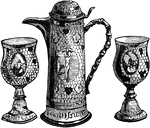 These communion cups and wine flagon are in an antique style. They are decorated with scriptural scenes and an open honeycomb pattern.