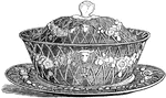 This butter dish is also known as a butter cooler. It has a cover and is designed in a trellis work of creeping plants.