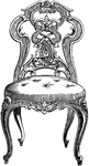 This chair was made in Paris, France in the Elizabethan style. It has a carved wooden back with a cushion on the seat.