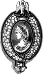 This cameo brooch is surrounded with diamonds on blue enamel and a female figure in the center. It has an eagle seated on the top.