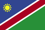 Color flag of Namibia. A wide red stripe edged by narrow white stripes divides the flag diagonally from lower hoist corner to upper fly corner; the upper hoist-side triangle is blue and charged with a yellow, 12-rayed sunburst; the lower fly-side triangle is green.