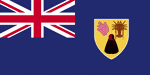 Color flag of Turks and Caicos Islands. Blue, with the flag of the UK in the upper hoist-side quadrant and the colonial shield centered on the outer half of the flag; the shield is yellow and contains a conch shell, lobster, and cactus.