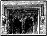 The window from Newarke Gateway at Leicester illustrating typical architectural ornamentation during the fourteenth century. On both sides of the window, there are two faces, a man and a woman on either side.