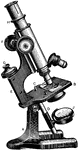 A Baker demonstration light microscope illustrating the different parts of the microscope. The eyepiece is adjusted at knob F. The mirror J reflects light from a light source to shine light through the sample.