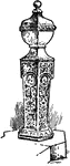 This illustration shows the baptismal font at Eastdown in England. It is made of stone and wood.