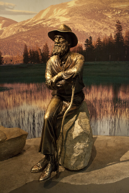 A Bronze Sculpture of John Muir Seated on a Rock