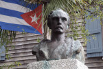 A Bust of Jose Marti with a Cuban Flag in the Background