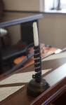 A Candlestick of Spiraled Iron on Desk