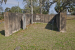 A Cinder Block Enclosure around Three Graves