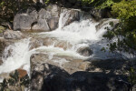 A Close-Up View of Rocks with Water Flowing over Them