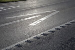A Closer View of Arrows Painted on a Road Surface