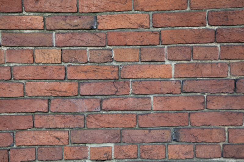 A Common Bond Brick Wall with a Cracked Brick