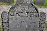 A Death's Head and Flowers on a Tablet Headstone