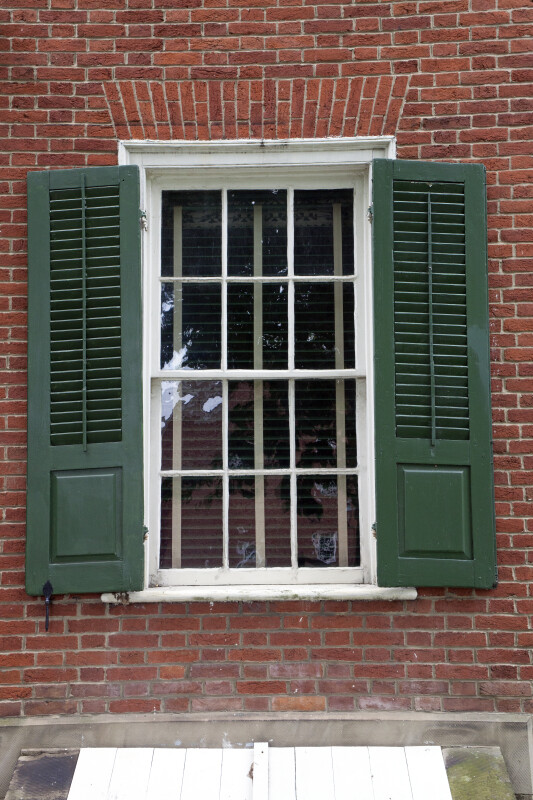 A Divided Window, with Shutters