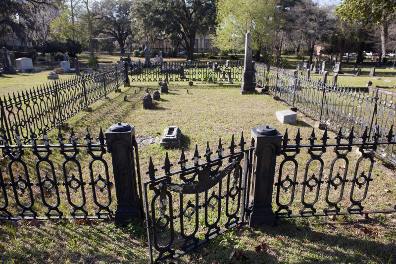 A Fence around Cemetery Headstones
