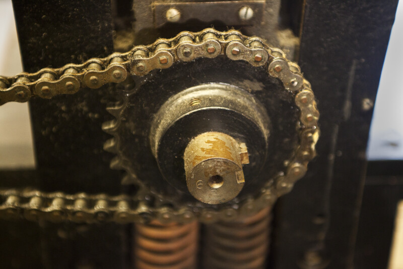 A gear in the side of a printing press.