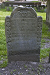A Headstone with a Chipped Top