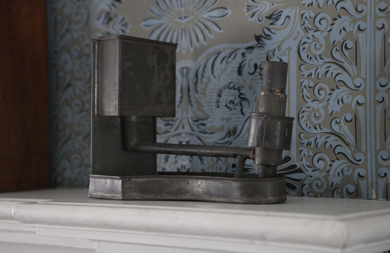 A Metal Object on the Mantel
