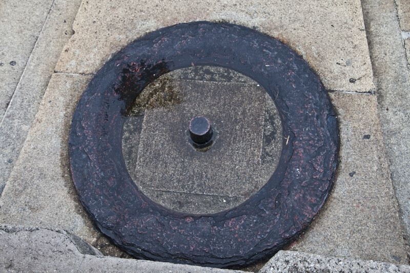 A Metal Pin in a Stone Block