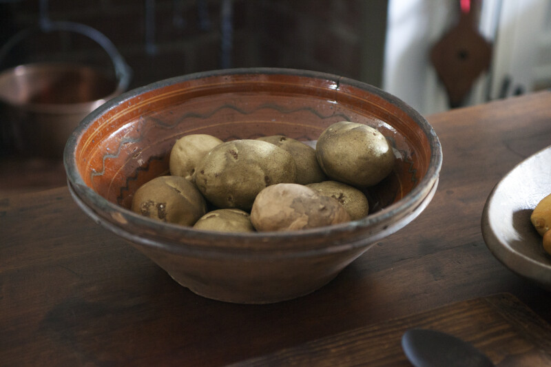 A Redware Bowl with Potatoes